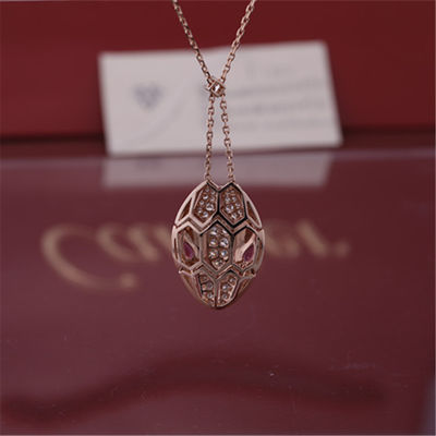 Kalite Rubellit gözlü ve başında pavé pırlantalı 18 kt pembe altın Roman Serpenti kolye fabrika